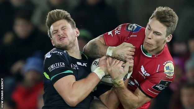 Dan Biggar and Liam Williams challenge for a high ball