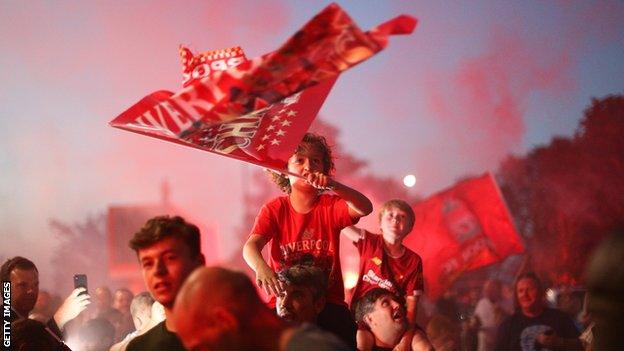 Liverpool fans celebrate winning the league at Anfield