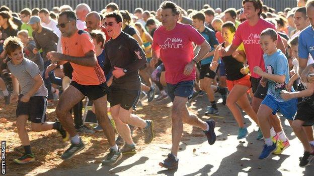 Lord Coe centre competes in a Parkrun in 2019