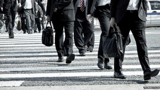 Commuters cross the road in Tokyo, Japan