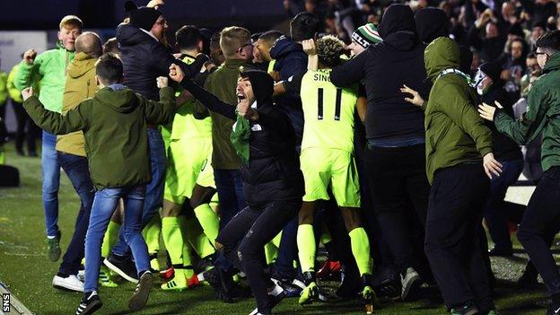 Scott Brown and team-mates celebrate his winner with Celtic fans