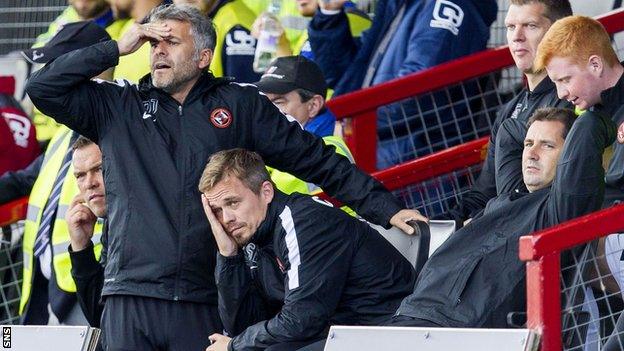 United coaches Darren Jackson and Simon Donnelly look just as dejected as manager Jackie McNamara