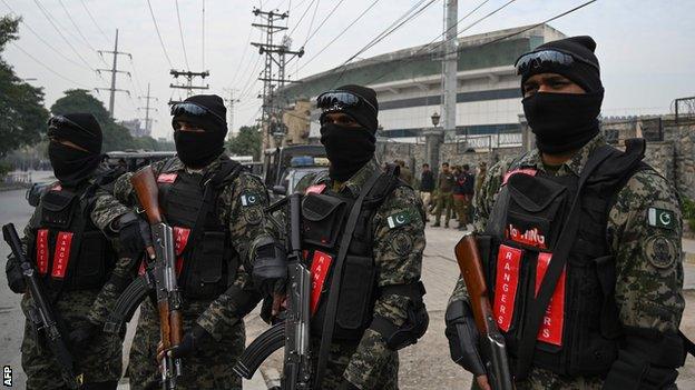 Pakistani paramilitary soldiers stand guard outside the Pindi Cricket Stadium in Rawalpindi