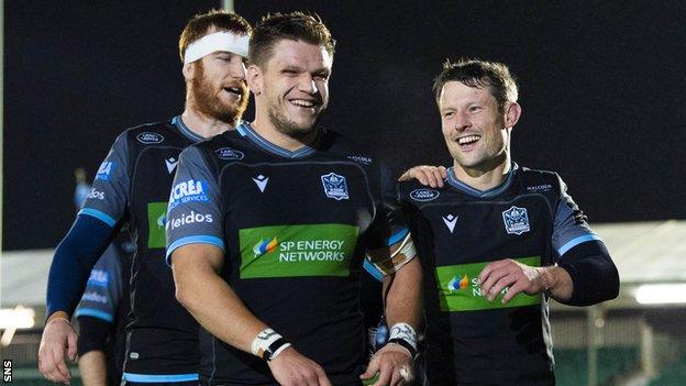 Scotland international George Turner, centre, has committed to Glasgow Warriors for the next two years