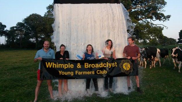 Milk Bucket Challenge: Picture of milk being poured over some young farmers