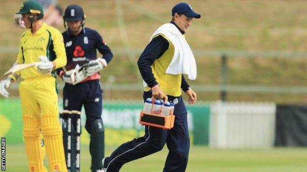 Joe Root carrying drinks