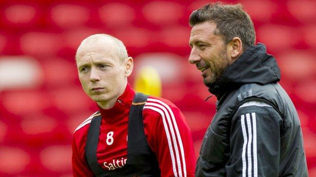 Aberdeen's Willo Flood and manager Derek McInnes