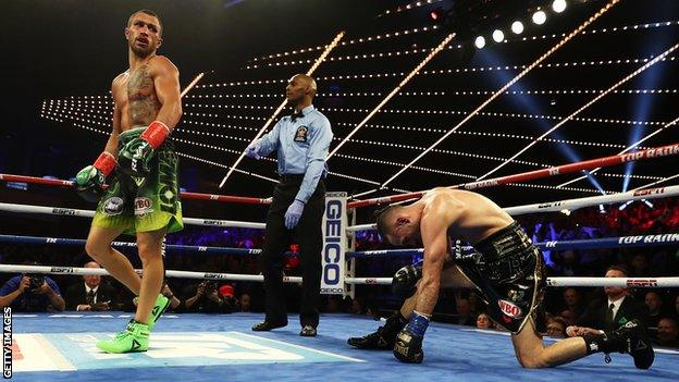 Vasyl Lomachenko (left) looks on after knocking down Jose Pedraza