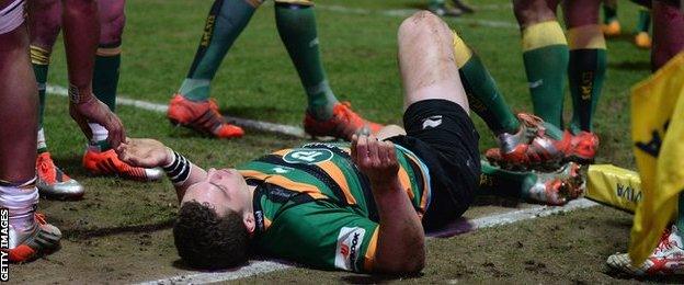 George North lies on the floor after suffering a blow to the head during Northampton's 52-30 win against Wasps in March 2015