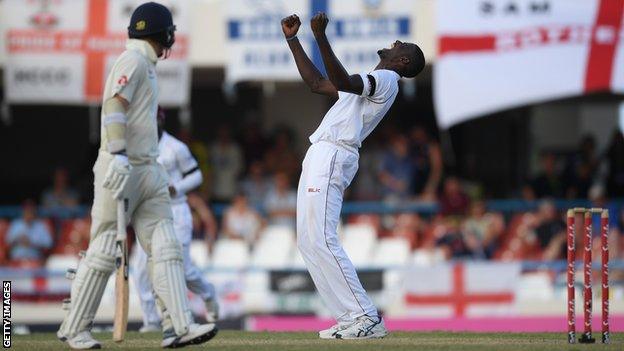 West Indies captain Jason Holder celebrates taking the wicket of James Anderson