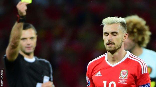 Wales' Aaron Ramsey is booked against Belgium