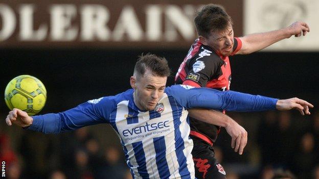 Coleraine's Darren McAuley battles with Crusaders' Billy Joe Burns at the game in January