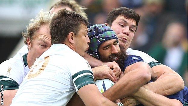 Josh Strauss is smothered by the Boks