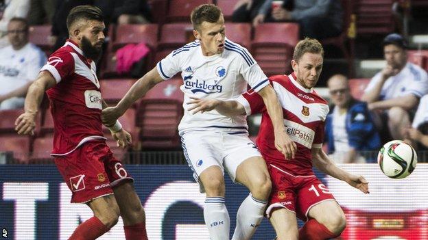 Shane Sutton, left, and Craig Williams from Newtown battle for the ball with FC Copenhagen's Marvin Pourie