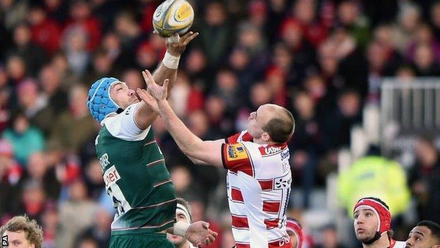 Leicester lock Graham Kitchener outjumps Gloucester full-back Steve McColl at Kingsholm