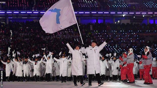 Athletes from North and South Korea entered the stadium for the 2018 Winter Olympics under the same flag