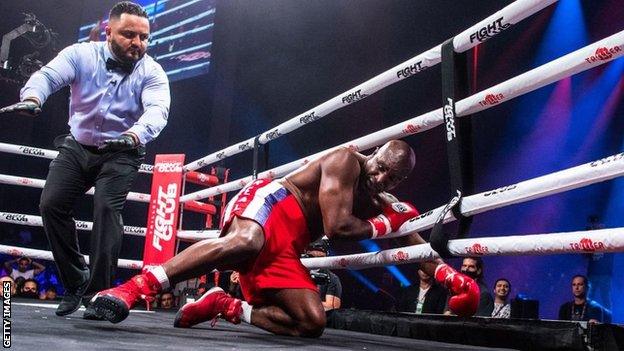 Evander Holyfield is knocked down by Vitor Belfort during the first round of the fight during Evander Holyfield vs. Vitor Belfort presented by Triller at Seminole Hard Rock Hotel & Casino on September 11, 2021 in Hollywood, Florida.