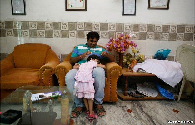 Sunil Jaglan, village chief with his daughter