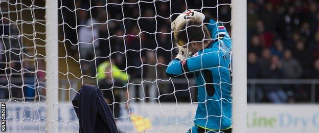 Dundee goalkeeper David Mitchell appeared to carry the ball over the line at Dens Park