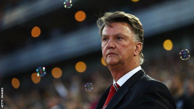 Louis van Gaal surrounded by bubbles at West Ham