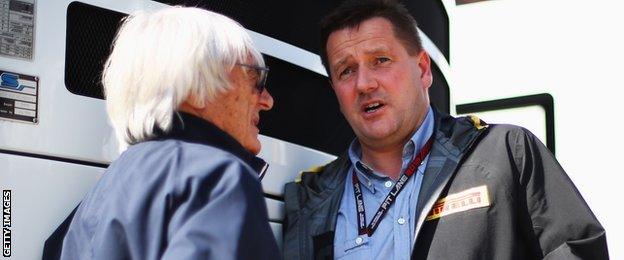 F1 boss Bernie Ecclestone talks to Pirelli Motorsport director Paul Hembery