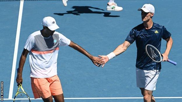 Rajeev Ram and Joe Salisbury celebrate winning a point in the Australian Open men's doubles semi-finals