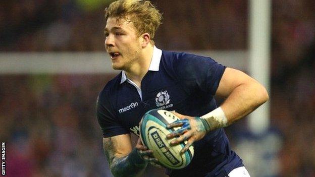 Dave Denton runs with the ball for Scotland against England