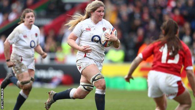 England's Poppy Cleall runs with the ball