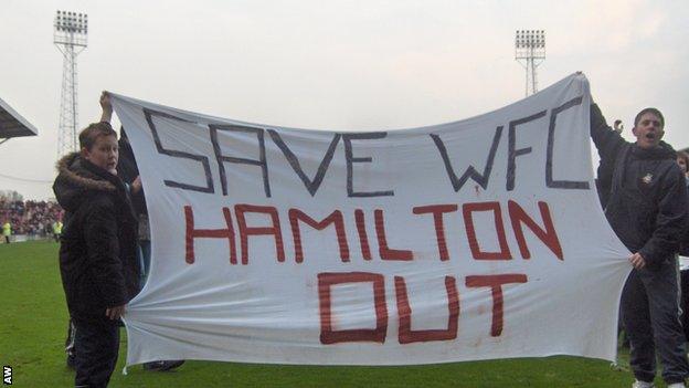 Wrexham fans protest against club owner Alex Hamilton