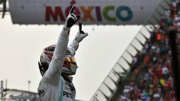 Lewis Hamilton salutes the crowd