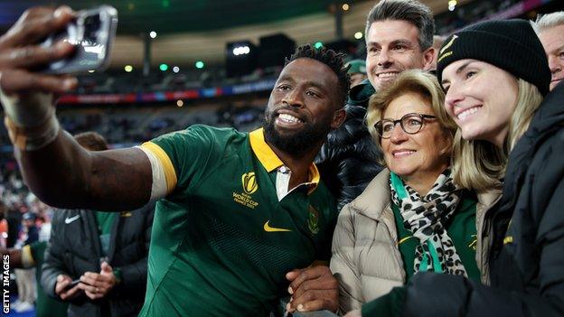 Siya Kolisi celebrates with fans