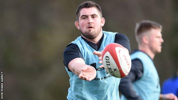 Wyn Jones passes the ball during training