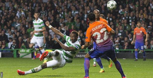 Moussa Dembele hooks in Celtic's third goal against City