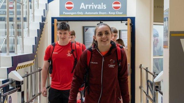 Team members arriving back at Ronaldsway Airport