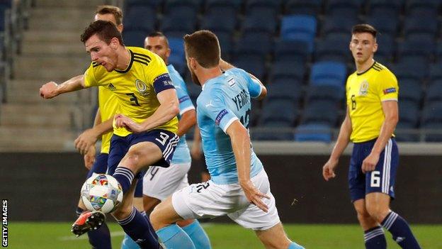 Andrew Robertson clears as Kieran Tierney looks on in Scotland's 2-1 loss to Israel