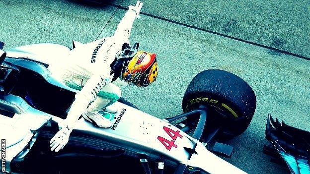 Lewis Hamilton celebrates winning the Japanese GP.