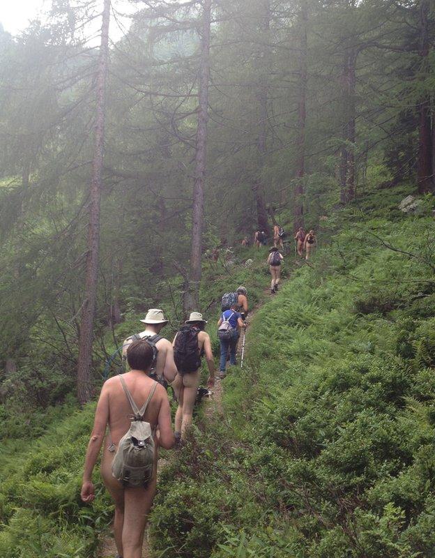 Nudists hiking through the Austrian Alps