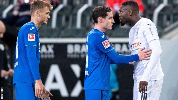 Marcus Thuram (right) and Stefan Posch (right)