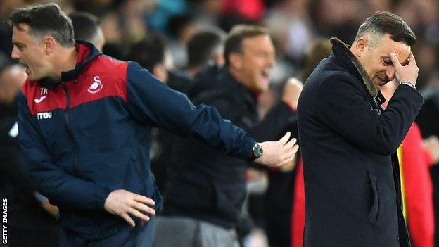 Manager Carlos Carvalhal (R) has watched his Swansea side fall back into relegation danger