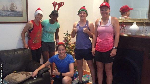 Heather Knight (second right) and her Hobart Hurricanes team-mates