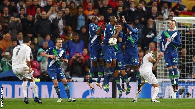 Cristiano Ronaldo scores the third of his three goals against Wolfsburg in 2016