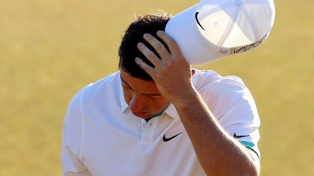 Rory McIlroy shows his disappointment as he walks off the 18th green on Friday