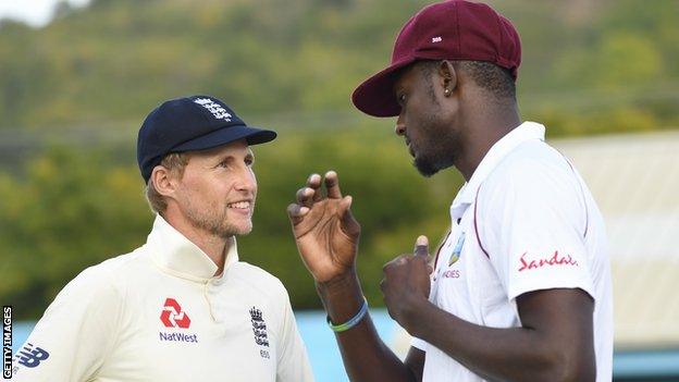 Joe Root talks to Jason Holder