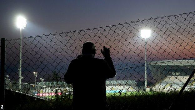 Fan outside the ground