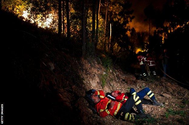 Firefighters rest during the wildfires of central Portugal in June 2017