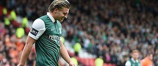 Jason Cummings looks anguished after chipping his penalty over the bar