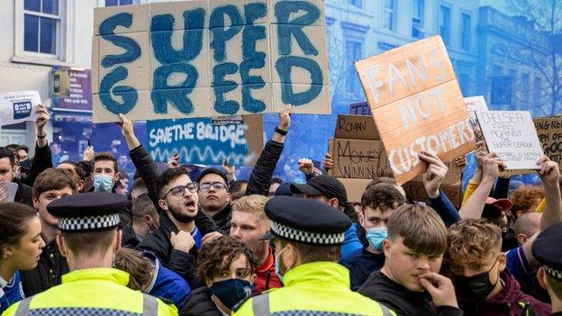 Fans protest at Chelsea on Tuesday before it was announced the six English clubs would not join a European Super League