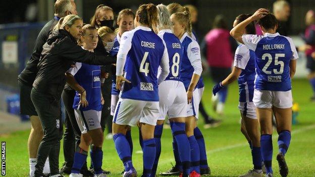 Birmingham players with Carla Ward during the FA Cup semi final