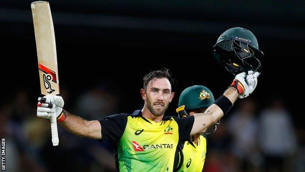 Australia's Glenn Maxwell celebrates scoring a century and winning the game against England