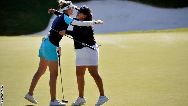 Nelly Korda reacts with Lizette Salas after putting in to win on the 18th green during the final round of the KPMG Women's PGA Championship at Atlanta Athletic Club